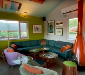 Bobo's Snack Bar inside lounge area with large sectional couch, cozy chairs and end tables.
