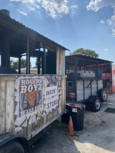 Rogers Boyz has their smokers and grill outside, while their storefront that sells their delicious Austin BBQis inside the gas station 