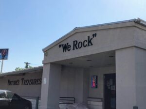 The main entrance of Nature's Treasures, with their motto "We Rock" emblazoned above the door.