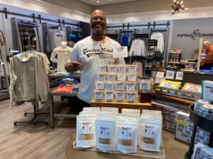 Sean Gooden with his display of GoodenSweet Cookies at Austin Bergstrom International Airport.