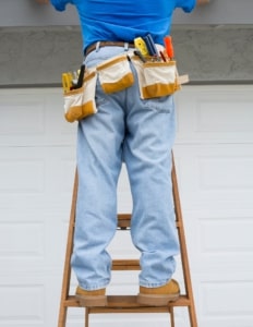 home inspector on ladder