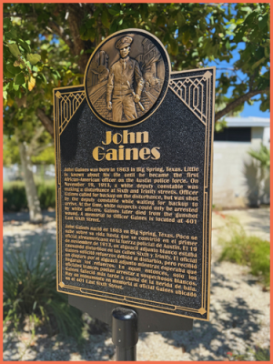 The memorial plaque that stands outside John Gaines Park in the Mueller neighborhood.